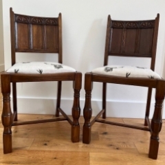 Both Refurbished Dining Chairs showing the carved back and the legs